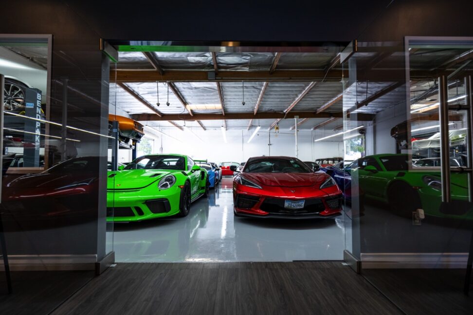 Exotic and classic cars stored on the epoxy warehouse floor at So Cal Classic Car Storage