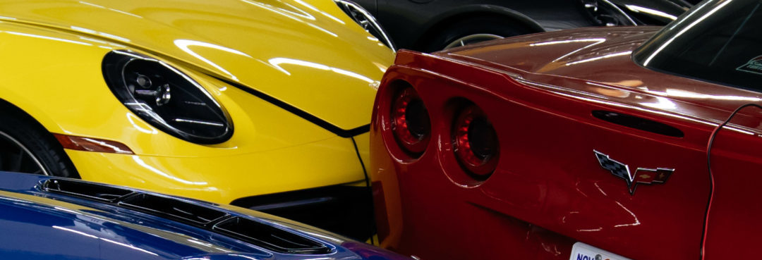 Cars under privacy shades in the warehouse